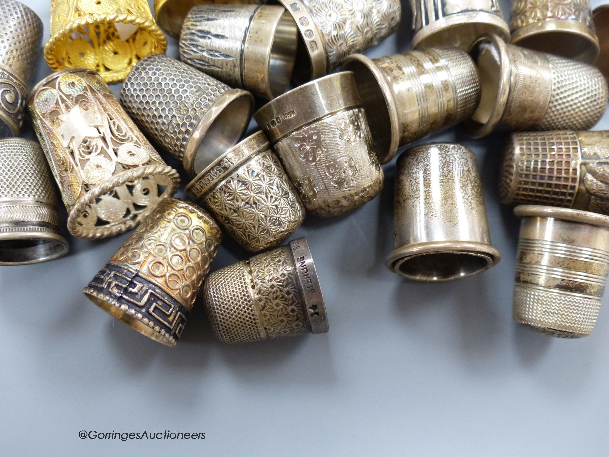 A collection of silver thimbles including a silver Charles Horner thimble